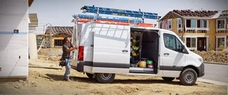 Contractor getting material from upfitting van.